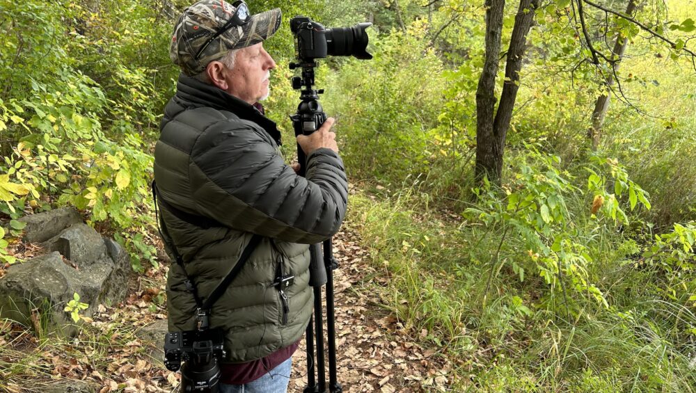 Barry holding gear during photography shoot