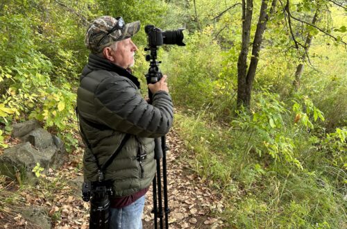 Barry holding gear during photography shoot